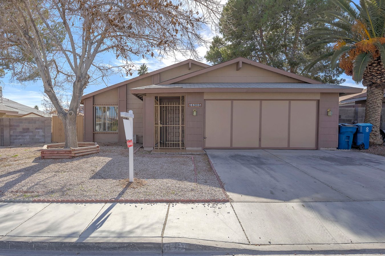 Nice single story home with 4 bedrooms, 2 bathrooms, huge living room with vaulted ceilings, open kitchen with island, dining area with fireplace, tile & laminated wood floors through out, master bedroom with walk-in closet and bathroom, security bars throughout and covered patio with an enclosed area. A must see!