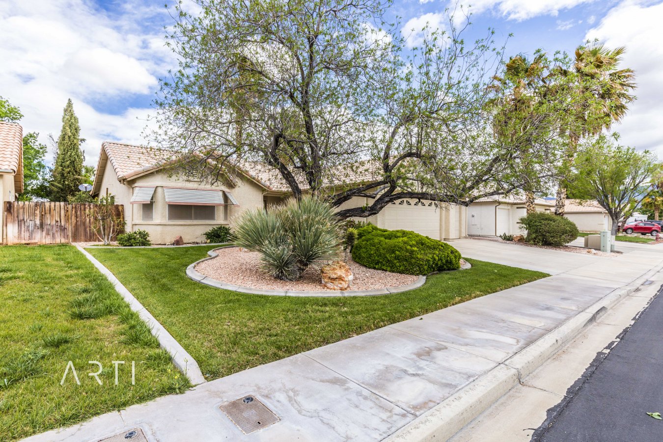 32100 Don't miss out on this beautiful, well kept 2 Bedroom, 3 car garage home in a NO HOA Community. When entering this home you will notice its not your average home! It features 2 bedrooms, a large living room, 2 dining areas, a wood burning fireplace and a bonus living room! The backyard is just as impressive as the inside with 2 waterfalls, a tiled covered patio and a storage unit. Mesquite is a premier location to soak up the sun with numerous activities such as our local recreation center, community events, world class golf, and much more!