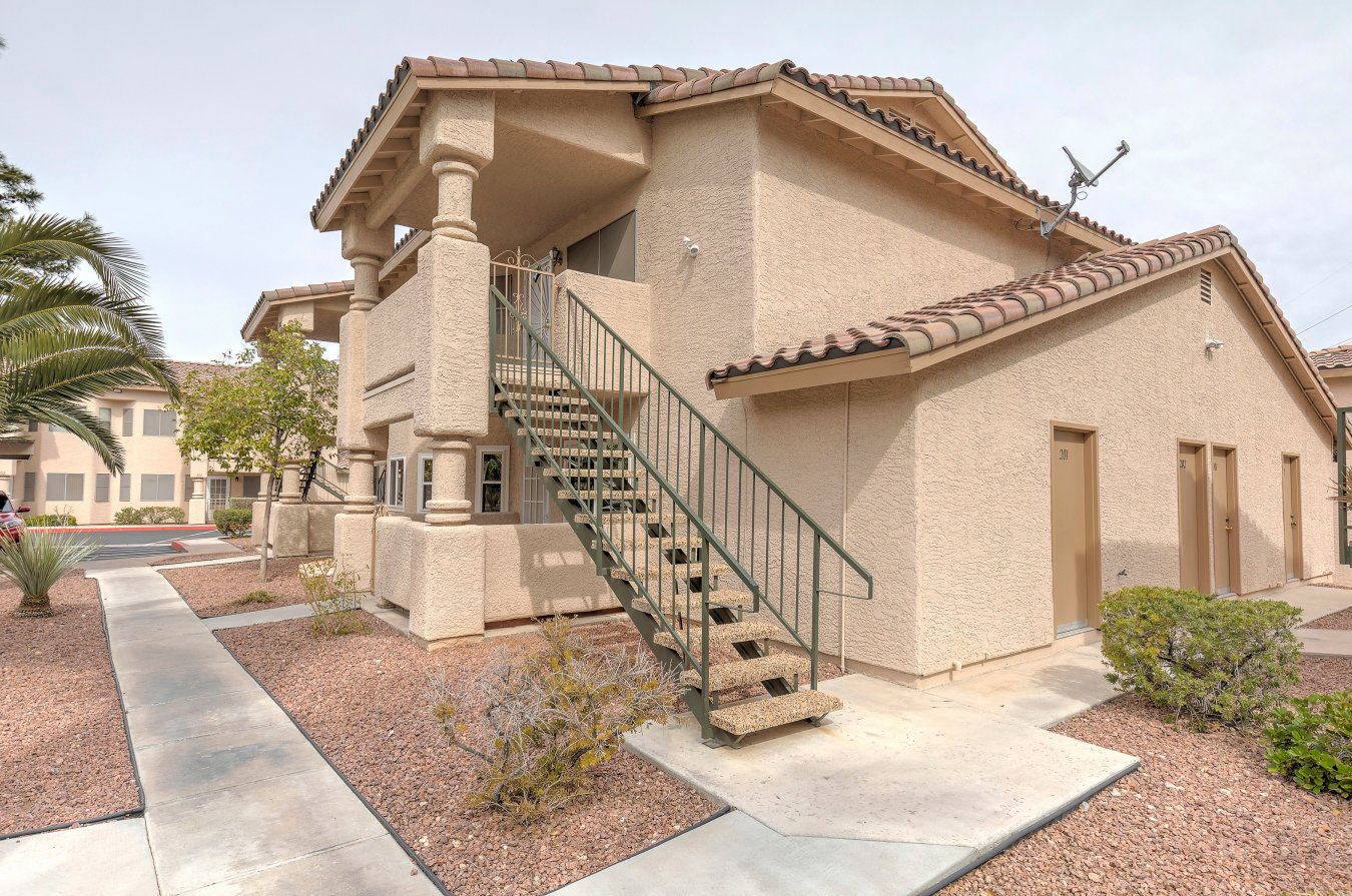 39081 Located in Summerlin but without the additional fees. Fabulous upstairs two bedroom home overlooking the gated pool & spa area. This is the largest rock springs vista condo available. Pergo flooring, granite countertops and stainless steel appliances abound. Both bathrooms have been remodeled. Master has a shower with seat. Newer washer and dryer, solar screens and jetted tub. Located near your covered parking.