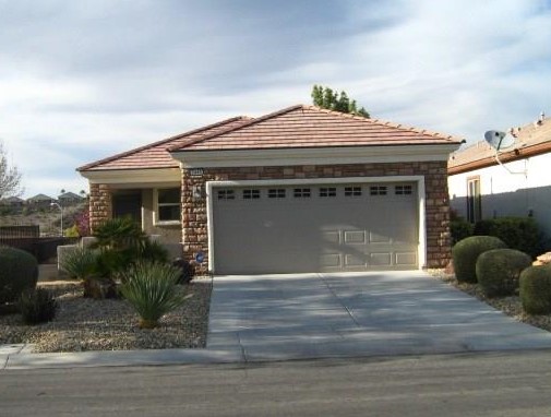 39299 Great VIEW of the mountains in the distance, from the patio or MB. This home has the stone faced front, and court yard entry. it also has a walk-way around to the back yard and an extended patio. Inside, the owner has added wood flooring in the living room and upgraded tile flooring in the busy areas. The garage has custom cabinetry, epoxy flooring, and a water softner(1 year old). home is only lived in for three months out of the year. MUST SEE!