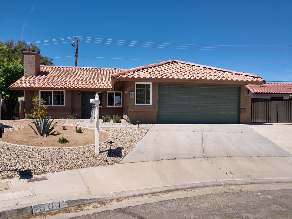 39977 Absolutely stunning!! Beautiful one Story 3 Bedroom 2 Bath home completely remodeled. Gorgeous open floor plan. Fabulous kitchen boasts granite counter tops, new stainless steel appliances, new custom cabinets and large island. Impressive stack stone fireplace. New flooring throughout. All new dual pane windows, new Water heater , just painted, inside and out. Desert landscaping with lighting. No HOA, RV Parking. Too much