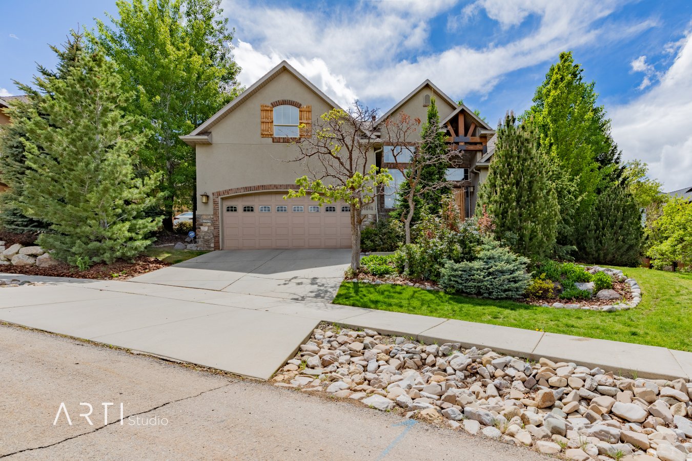 40552 This gorgeous, meticulously maintained home is nestled among the grand mountain peaks in Suncrest. Handcrafted lighting in the entry and large wooden beams framing the basement entrance are just a few of the custom touches you will find throughout. The main floor features the master suite with a walk out to the trellised patio overlooking the wooded and private backyard, two additional bedrooms, and an open gourmet kitchen perfect for entertaining! Perched above the living room is an open loft, a full bath, and a large bedroom with an incredible valley view. The walkout basement with 10 foot ceilings features two bedrooms (with an option for a third), a large family room with a stone fireplace, a kitchen and ample storage. If you ever get tired of the peaceful yard, a few blocks from your front door is the Ridge Cafe and market, Suncrest clubhouse, pool with lazy river, basketball court, tennis courts, a gym and hiking and biking trails galore! You don't want to miss out on all this unique mountain retreat has to offer!