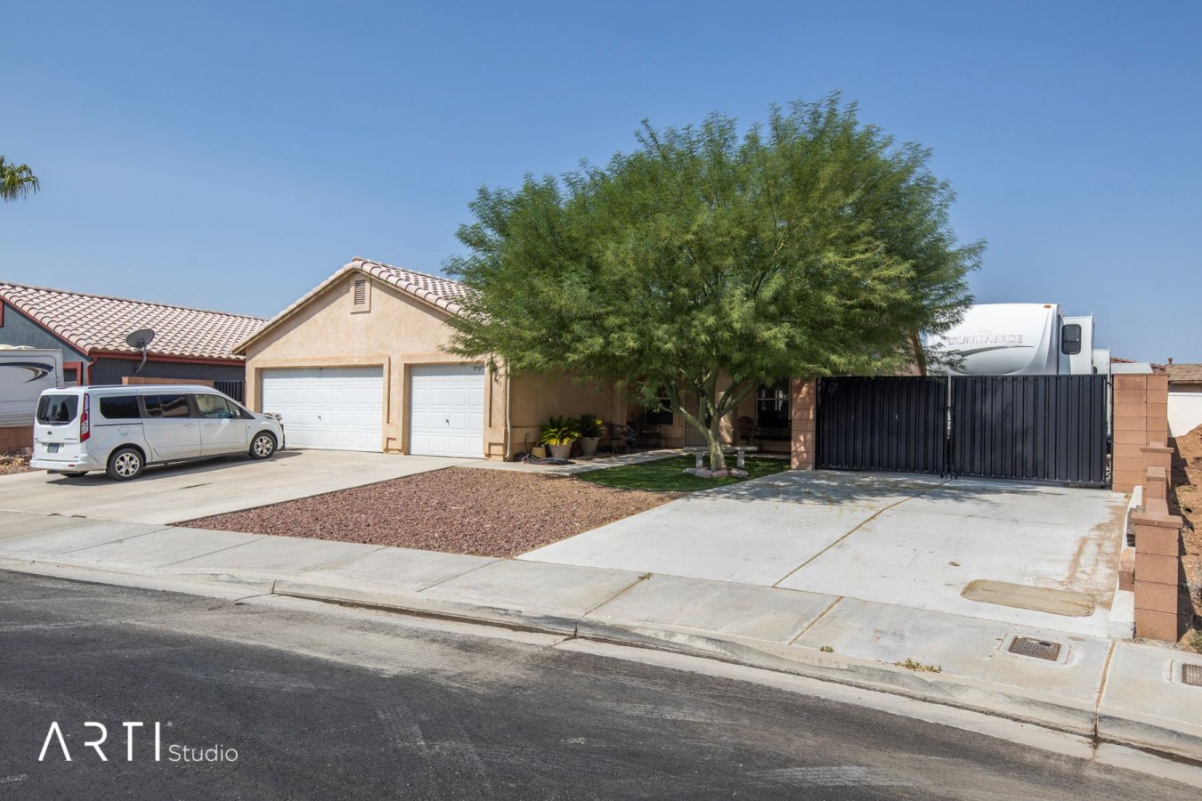 42649 All of your needs in a home are all right here. No HOA with RV parking. This home has the best of both worlds plus a 3 car garage for all the toys. Stop by and check out this fabulous home located 1 hour north of Las Vegas and 36 minutes to St. George.This 4 bedroom home has an open floor plan for entertaining and a wood burning fireplace for those cool winter evenings. The back patio is covered and shaded with plenty of trees.