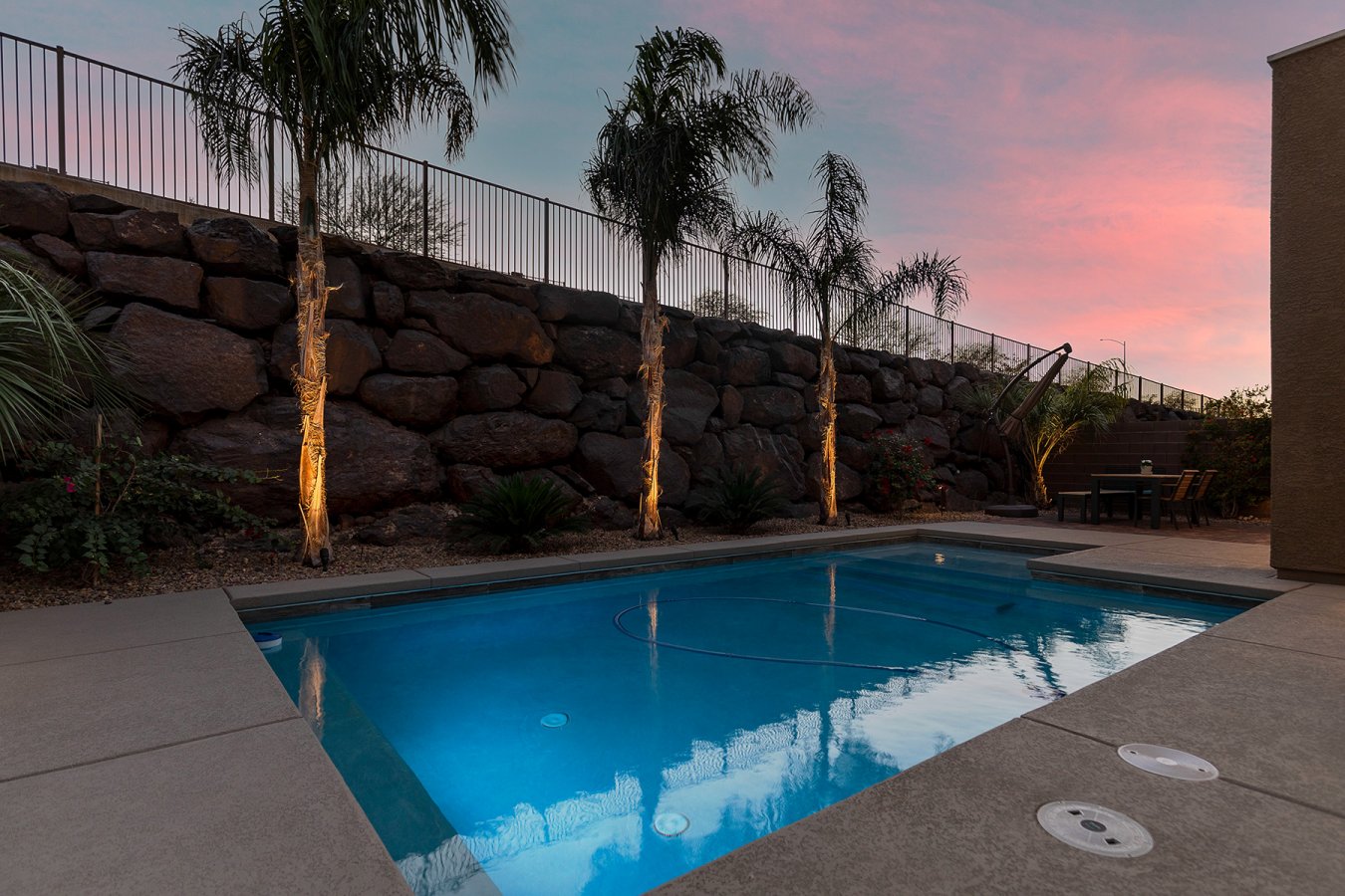 44489 Better than New! This 2-story home built in 2016 has been upgraded with all the fixings. POOL, SOLAR (owned), SHUTTERS throughout, modern FANS, and top of the line STAINLESS APPLIANCES. Enjoy coffee on your private balcony off of the primary bedroom as you look at your MOUNTAIN VIEWS all around! This 3120 sqft home in gated community near Black Mountain has 4 oversized bdrms (1 bed down), 3 full baths, flex space for dining/office/fitness, loft & 3bay tandem garage. Kitchen features oversized granite island, large walk-in pantry, and huge mudroom/drop-zone. Upstairs laundry room w/double entry into primary closet. Rear yard equipped with covered patio, beautiful landscaping low-voltage lighting, pool, and plenty of patio for entertaining. NO BACKYARD NEIGHBORS!