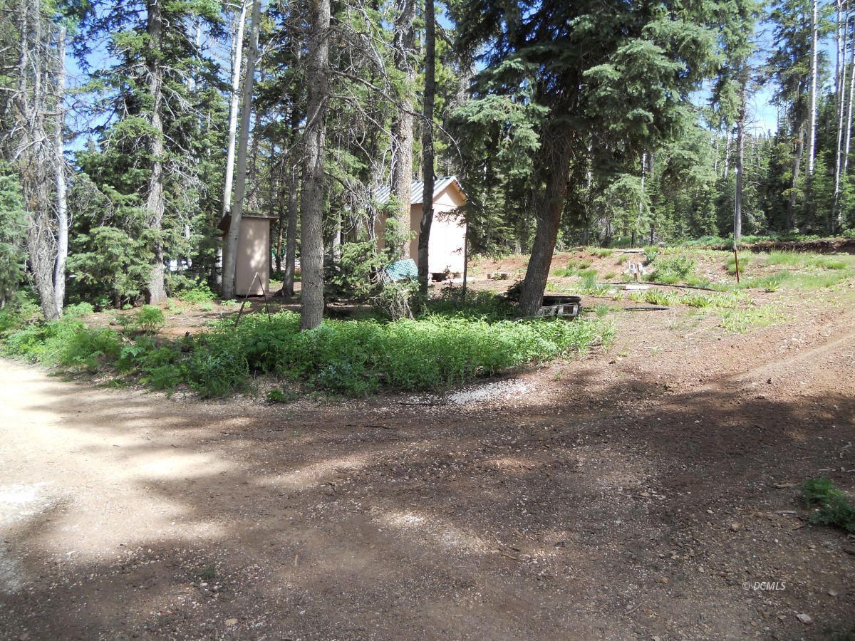 45959 This corner lot has EVERYTHING you need! 2-10x20 concrete RV pads ready for your RV's, The property has the water , a septic tank, and Power to the lot. There is ''U'' shaped driveway and a small utility shed included. Ready to use with your RV or to build your dream cabin and start enjoying the mountain. 2 lot were combined to make this spectacular property.