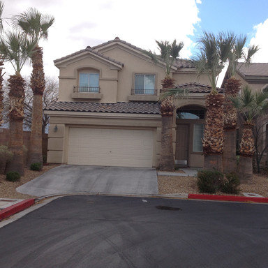 Beautiful Former Model home with wood flooring through out downstairs. Plush carpet throughout upstairs. Desert Landscaping front and back, with cover patio! 3 bedroom 2.5 baths, master bedroom separate from other bedrooms. All appliances. Built -in bookcases in living room with a cozy gas fireplace. Gated community with pool & spa!