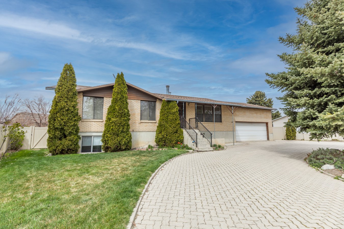 47538 Awesome investment opportunity! Front walk-out basement with plenty of parking. Large, fully fenced yard with mature fruit trees, planters, and spaces to gather. Full brick, newer roof, HVAC and water heater. Ample storage over garage.