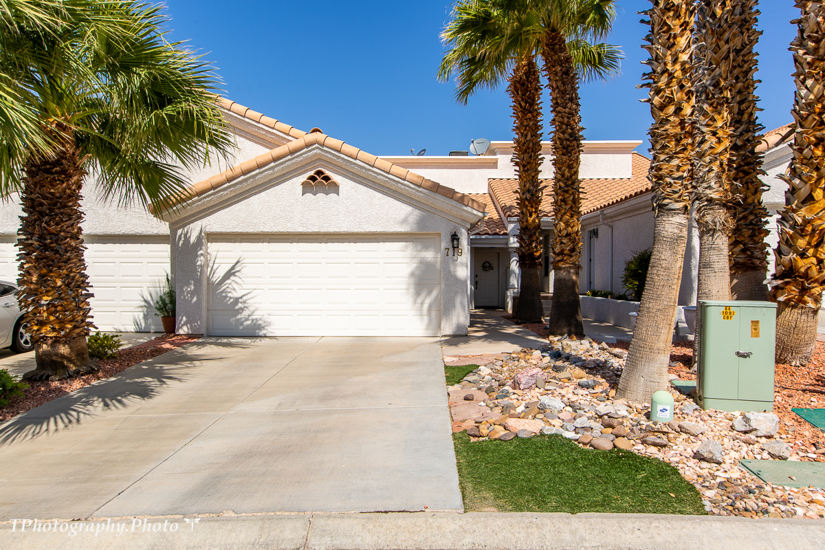 Don't miss out on this GEM in a great location. This home has been cared for and has new laminate floor in upper master bedroom. Great view of mountains and city. There is a nice little atrium in center of home with small plants on a dry waterfall. All appliances will stay with this home. The masters have walk in closets. the upstairs masters bedroom overlooks the living area with large tub and double vanities. The master bath on main level also has double vanities. The propane fireplace will make you want to snuggle up on the couch on those cold winter days or just want to set the mood. Come see this great townhome soon, it won't be on the market long!