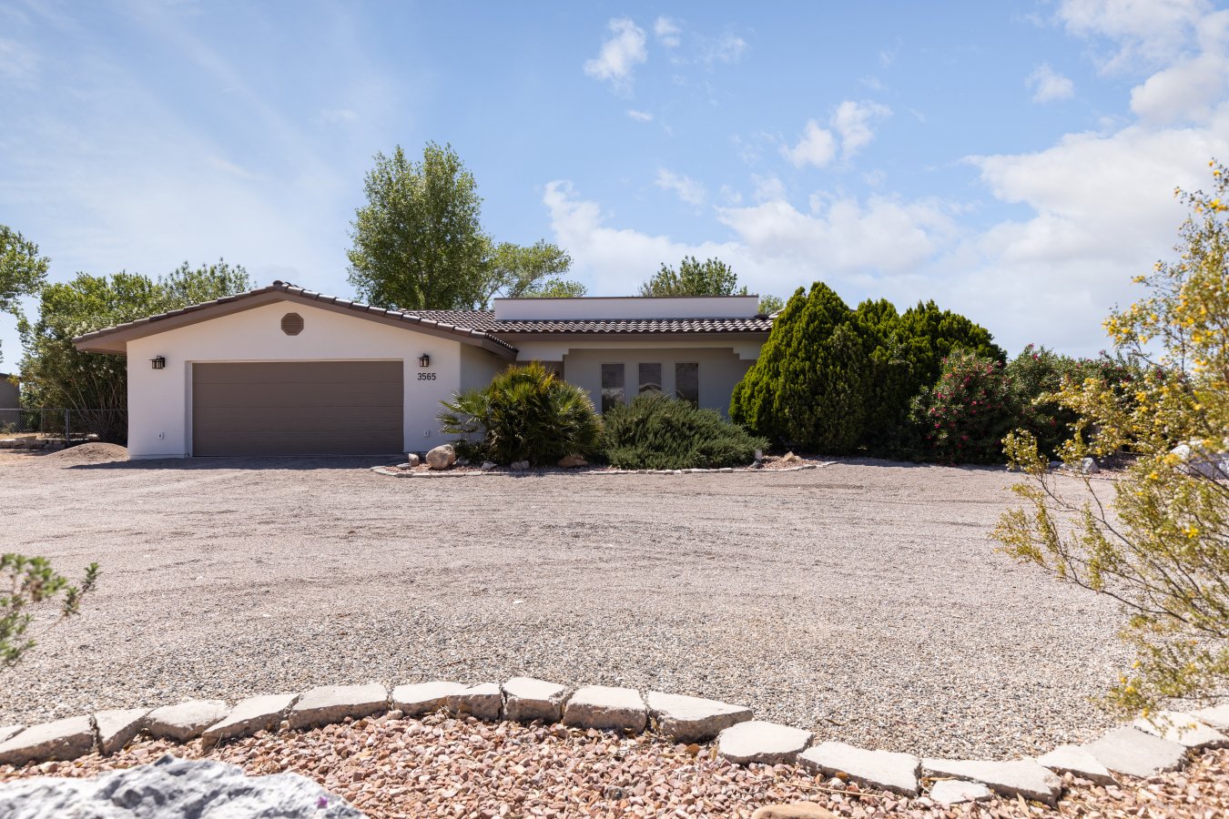 Diamond in the Desert!!! Wow, the workmanship and attention to detail is incredible to see in this 2,865-sf home with a wonderful 3,000 sf Saltillo tile patio that surrounds the exterior. The home has four bedrooms, two and half bath, large kitchen/dining room, two living rooms, one with a beautiful stone fireplace, game room that is large enough for a pool table, a 23' x 23' attached garage and a detached 23' 6