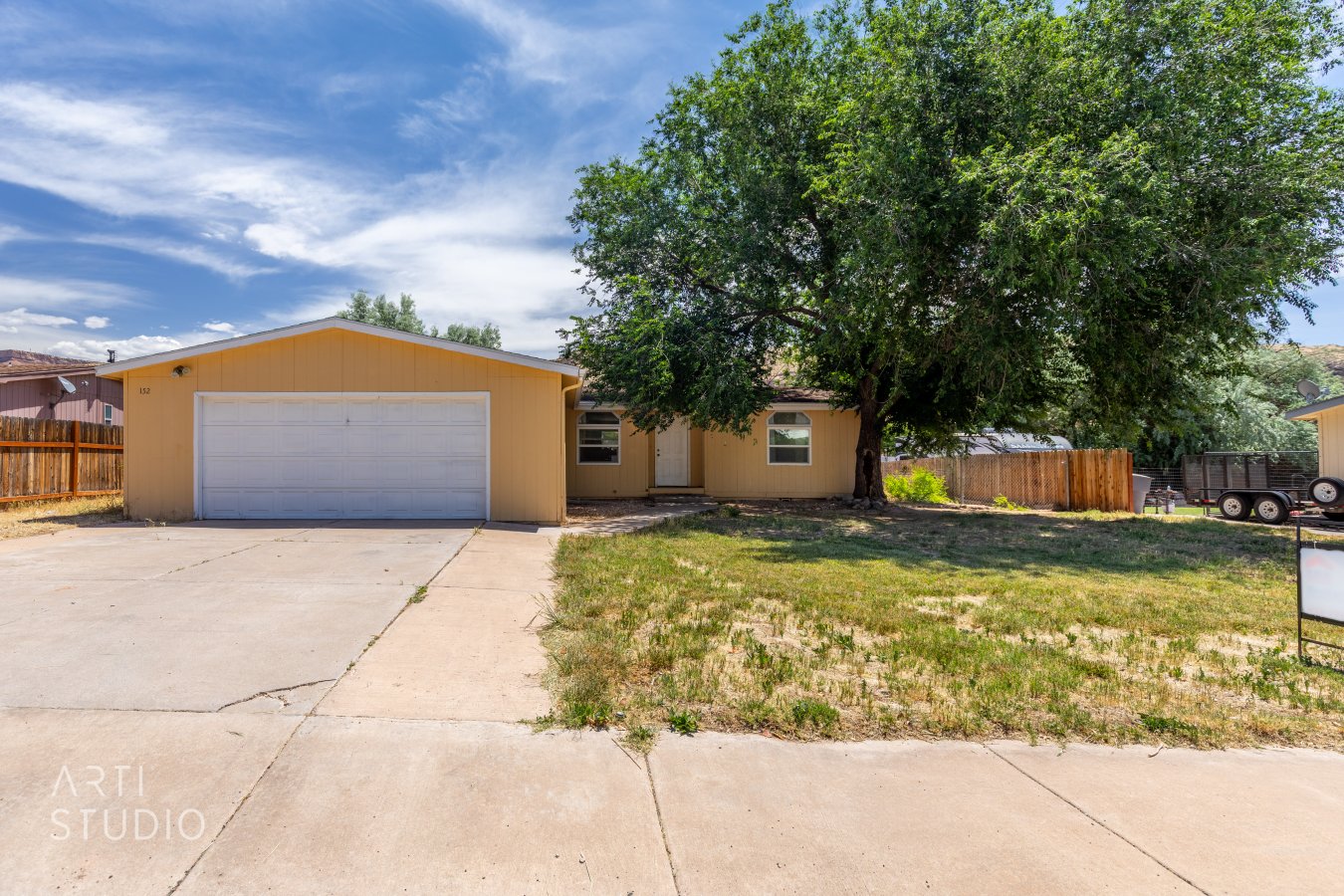 48878 This 3 bedroom 2 bath home with attached 2 stall garage has a nice shade tree in the front yard and a large fenced backyard. Come see this home before it's gone.