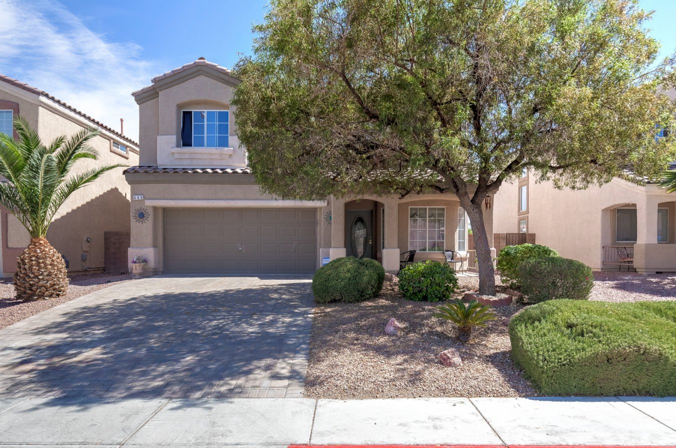 49380 Awesome gated community with a park in the North Las Vegas area! This home boasts a first floor primary bedroom with vaulted ceiling and fan! Great kitchen with granite counter tops that features a huge island with breakfast bar and solid granite back splash, solid hardwood cabinetry and a large pantry! Tile flooring throughout the first floor. The kitchen and open family room flow to create a beautiful area that is perfect for entertaining accented nicely by the gas fireplace. This area flows to a fully landscaped rear yard that includes an over sized covered patio and artificial turf for super low maintenance!!