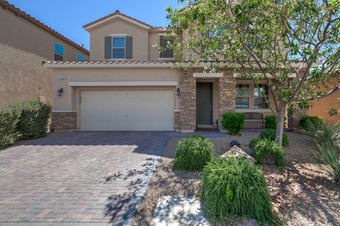 AMAZING Rhodes Ranch Country Club guard gated golf course community. Fantastic Mountain and City Views, this home features a backyard oasis with Heated pool & spa, fire pit and covered patio and no neighbors behind you. Fantastic Great Room, Gorgeous Gourmet kitchen with 2 pantries, custom kitchen cabinets with pull out drawers and granite counter tops. Bar in downstairs den stays and has access to pool area. Upgraded Laminate Wood Flooring and high ceilings, security cameras stay. Great Master Bedroom with balcony and City & Mountain Views. 2nd bedroom has own bath , walk-in closet and door to balcony. Large upstairs loft can be your 2nd Family room. This home is a 10+.