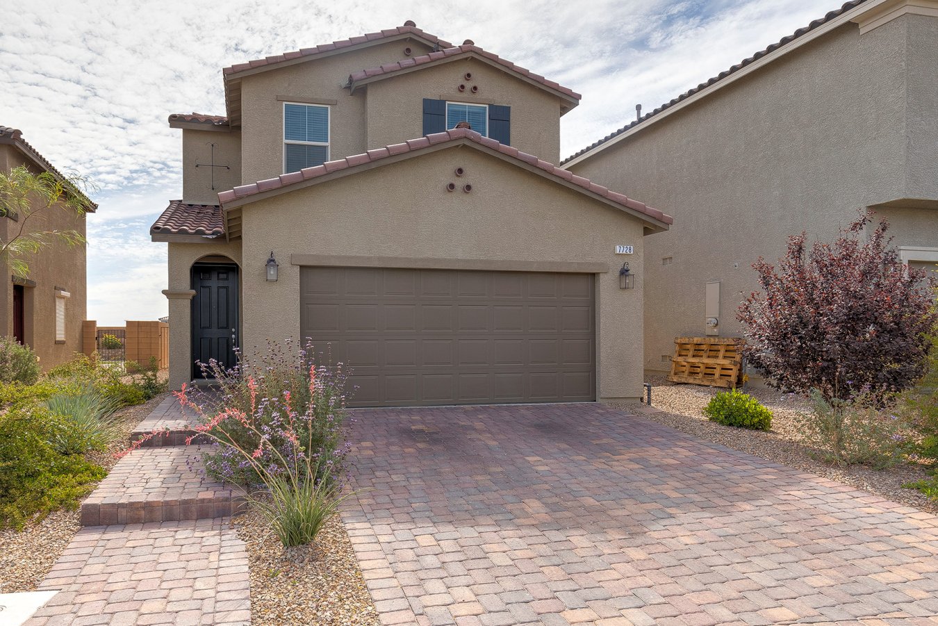 50129 An epic treasure in desirable SW Las Vegas! This prime location just off the 215 features 4 bedrooms including one downstairs, an open floor-plan, gourmet kitchen with a large island, granite countertops, custom upgraded cabinets & more! Stainless Steel appliances included! Upgraded backyard oasis with synthetic grass, pavers and beautiful trees, covered patio for entertaining! Located near top schools, shopping, dining, and entertainment! Plus, just 4 mins from the 215!!