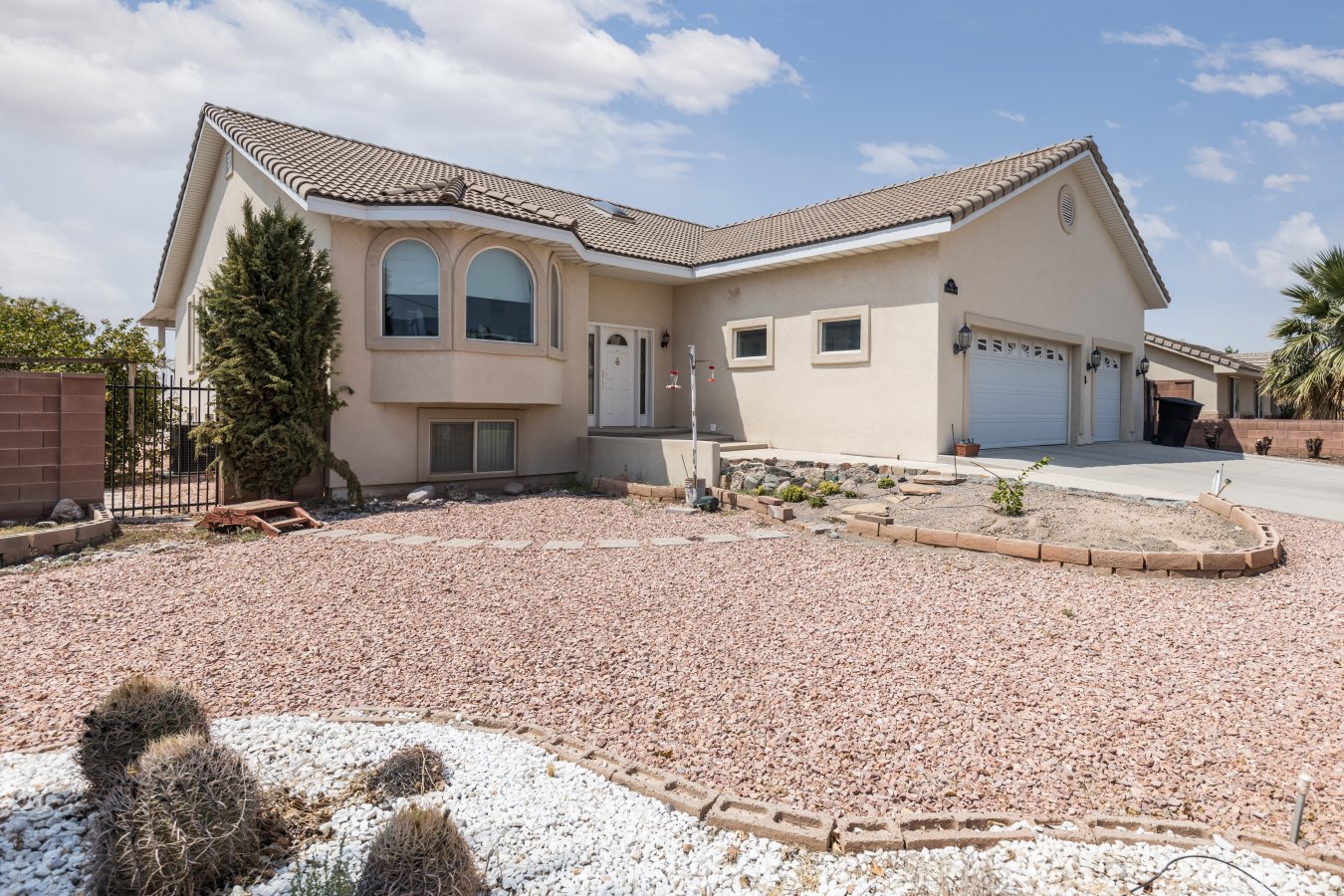 Rare find in Beaver Dam, Arizona!!! This custom-built home sits on a corner lot and has approximately 3800 sf. A lovely front entry into a split floor plan. The main level has a large kitchen and breakfast nook, master bedroom with bath, great room, half bath and laundry room. Downstairs in this split foyer design you will find a full kitchen, game room, two bedrooms, two baths, utility room and a walk out to the backyard. The lower level has its own access and the potential for rental income is very good. The exterior of the home has two covered decks, one off the great room and other off the master bedroom. A cinder block wall surrounds the property which has hookups and space to park an RV. A well-built home with 4