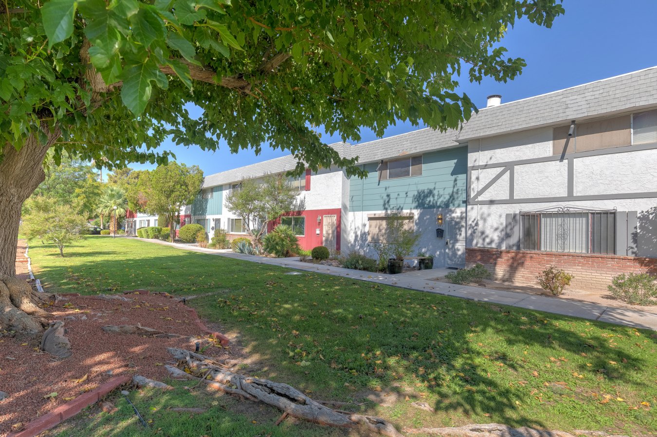 Rare find in today's market - spacious 2 bedroom townhome priced under $200,000!! Brand new carpet upstairs! Beautiful wood-look tile downstairs. Large living room with ceiling fan. Kitchen offers granite counters, black appliances and eat-in area. All existing appliances stay with the home. This home has lots of extra storage as well. There is a separate room off of the kitchen that could be used as an office. Upstairs there are two good sized bedrooms - both with walk-in closets! The upstairs bath features a custom tile walk-in shower. You will love the added protection of Rolladen shutters as well as a security door at the front entrance. Conveniently located to nearby freeway access, schools, shopping and restaurants. Enjoy the park-like area just outside your front door which has large mature trees and lush green grass that is maintained by the HOA. Community amenities include pool, tennis courts and clubhouse!