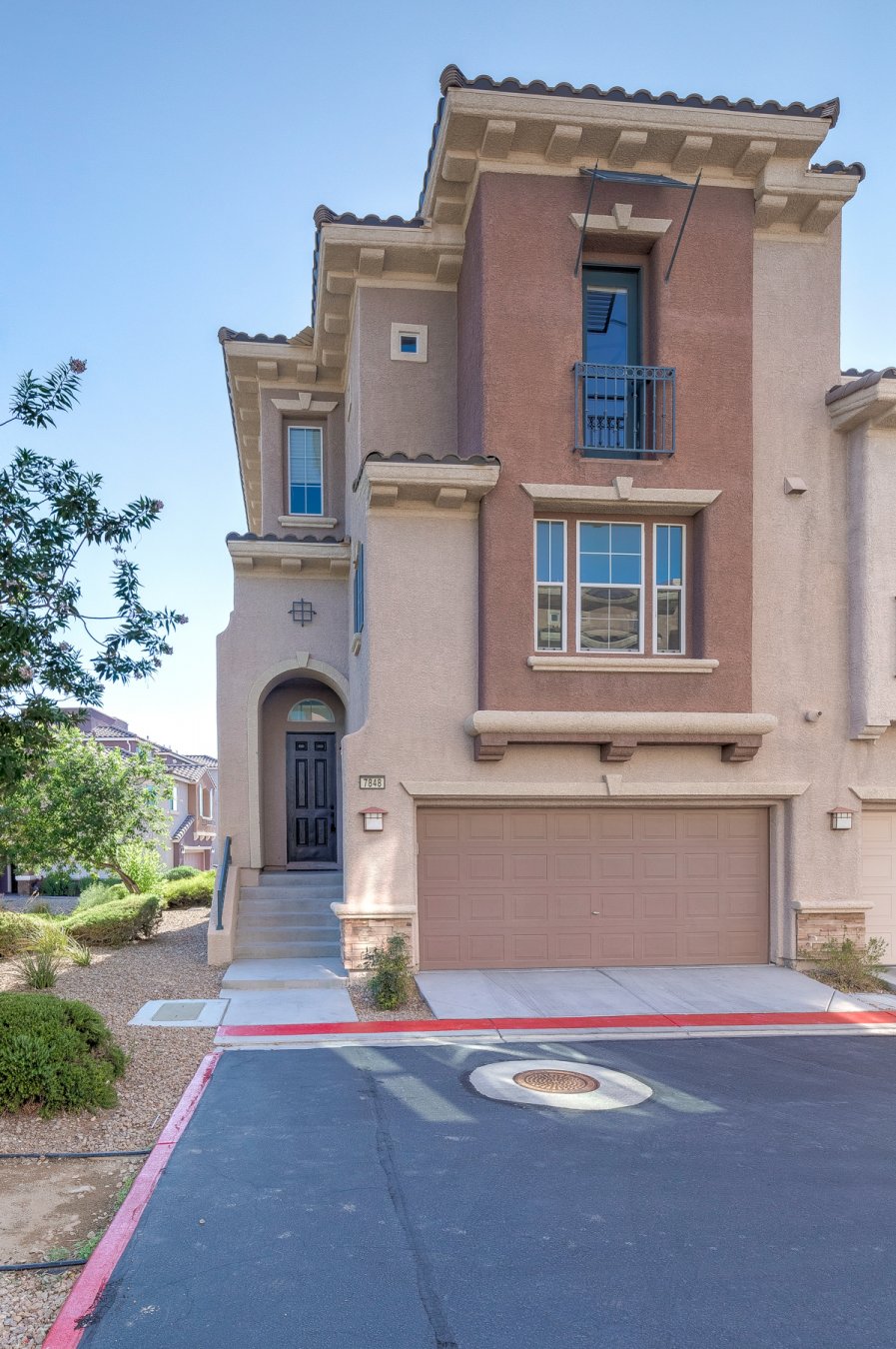 51552 Gorgeous townhome located in Master Plan Community of Mountains Edge! This is a rare floorplan from original builder, Engle homes which features an extra large primary bedroom on the 3rd floor with large walk-in closet. There is also a large Primary bedroom downstairs with full bath and back patio access and office area. 3rd bedroom with full bath and balcony area. The kitchen has been remodeled with white tile backsplash, Calacatta Eagle Quartz counter and double island. New home fixtures throughout and brand new carpet. Home is also situated in the corner lot with 2 full car garages and balcony of the main living floor. A must see!