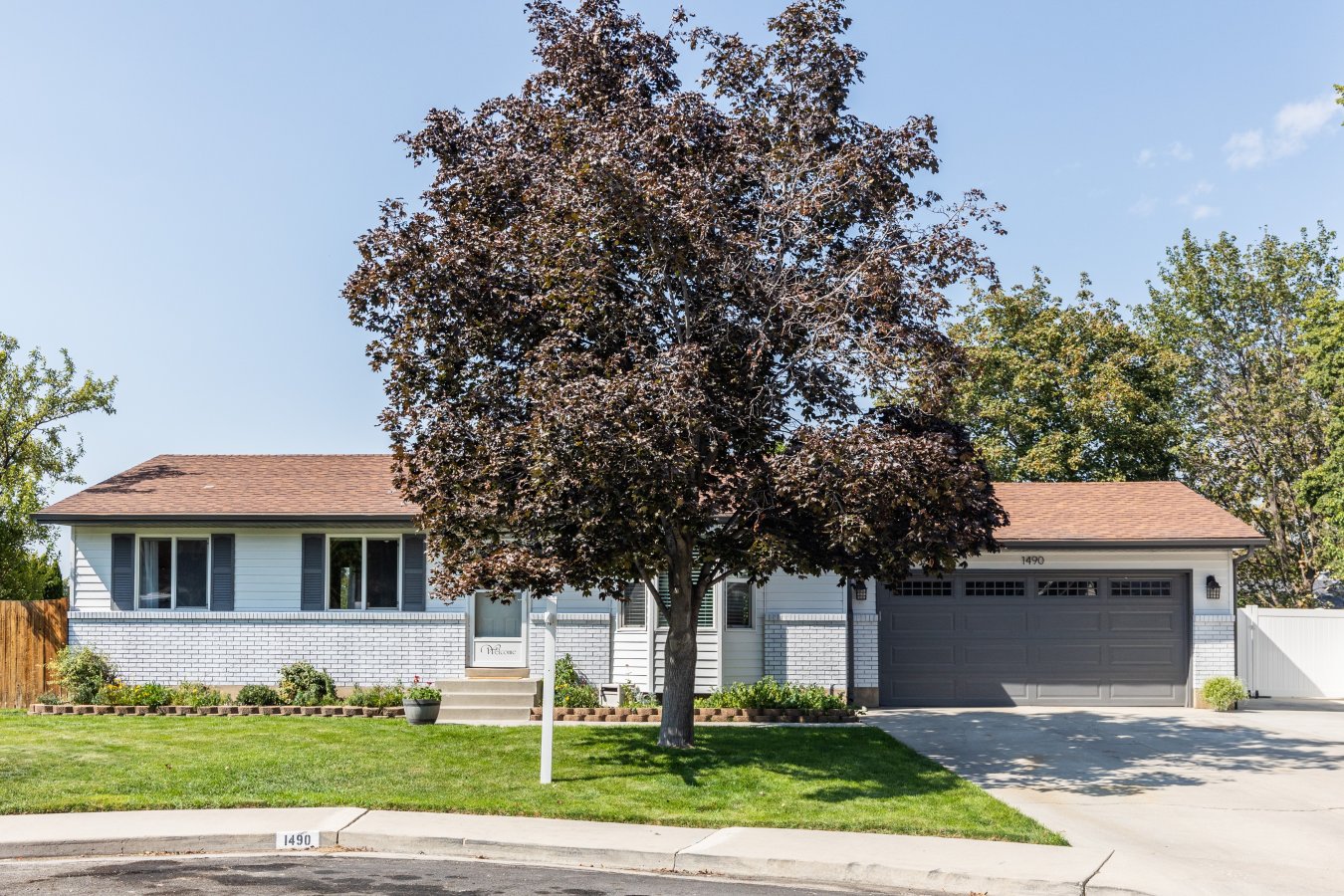 51861 You will enjoy so many features that add comfort and enjoyment to this centrally located Orem house. It has a remodeled white kitchen with a beautiful island that can seat 6 people. Soft close pantry cabinets make for easy access and organization. Upstairs bathroom is remodeled with floor to ceiling tile in the shower and modern choice of colors and product. New features also include engineered hardwood floors, carpet, paint, water heater, and garage door with warranty. Sixth bedroom in the basement is unfinished for a nice size storage room.
This has a sought-after large cul-de-sac yard, so hard to find this type of land these days! Ample garden space is next to a shed combination playhouse. Comes with a big patio covered with a new awning for outdoor enjoyment. Parking has been extended with newly poured cement for an RV, boat, or multiple cars with a double wide rolling vinyl gate.
Although tucked away in a quiet neighborhood, you are so close to shopping, I-15, UVU and BYU. Canyon access and Utah lake are also minutes away. OPEN HOUSE Saturday September 25, 11-1 pm.
Square footage is taken from County Records and to be verified by the buyer.