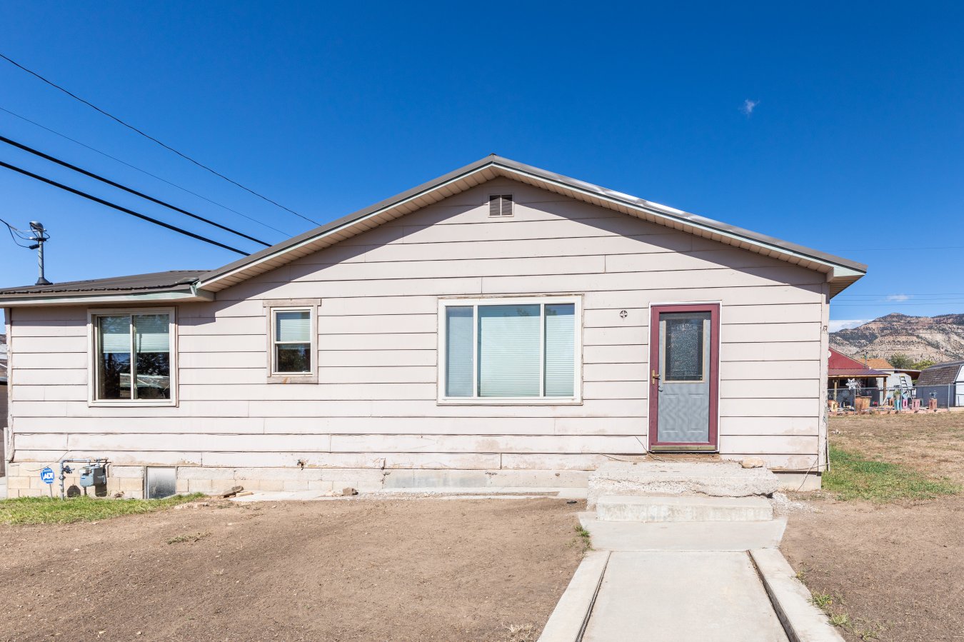 Are you ready to get away from over-crowded city life? Check out this one-of-a-kind home with an entire second lot included! If you love recreating in and around Utah's world famous Book Cliffs this opportunity is not one to pass up. The house is situated right at the main gateway which leads into the heart of East Carbon's residential neighborhoods. Click on the virtual tour link to experience how much special attention to quality and detail this owner has given their home. Each room has been remodeled and updated with a particular eye toward comfort, function, and style. From the top-down/bottom-up shades and wood burned art deco trim framing the windows to a gorgeous floor to ceiling travertine bathroom designed for peaceful evenings relaxing in the tub. You won't need to worry about having to fix things up before moving in. But buying a place with