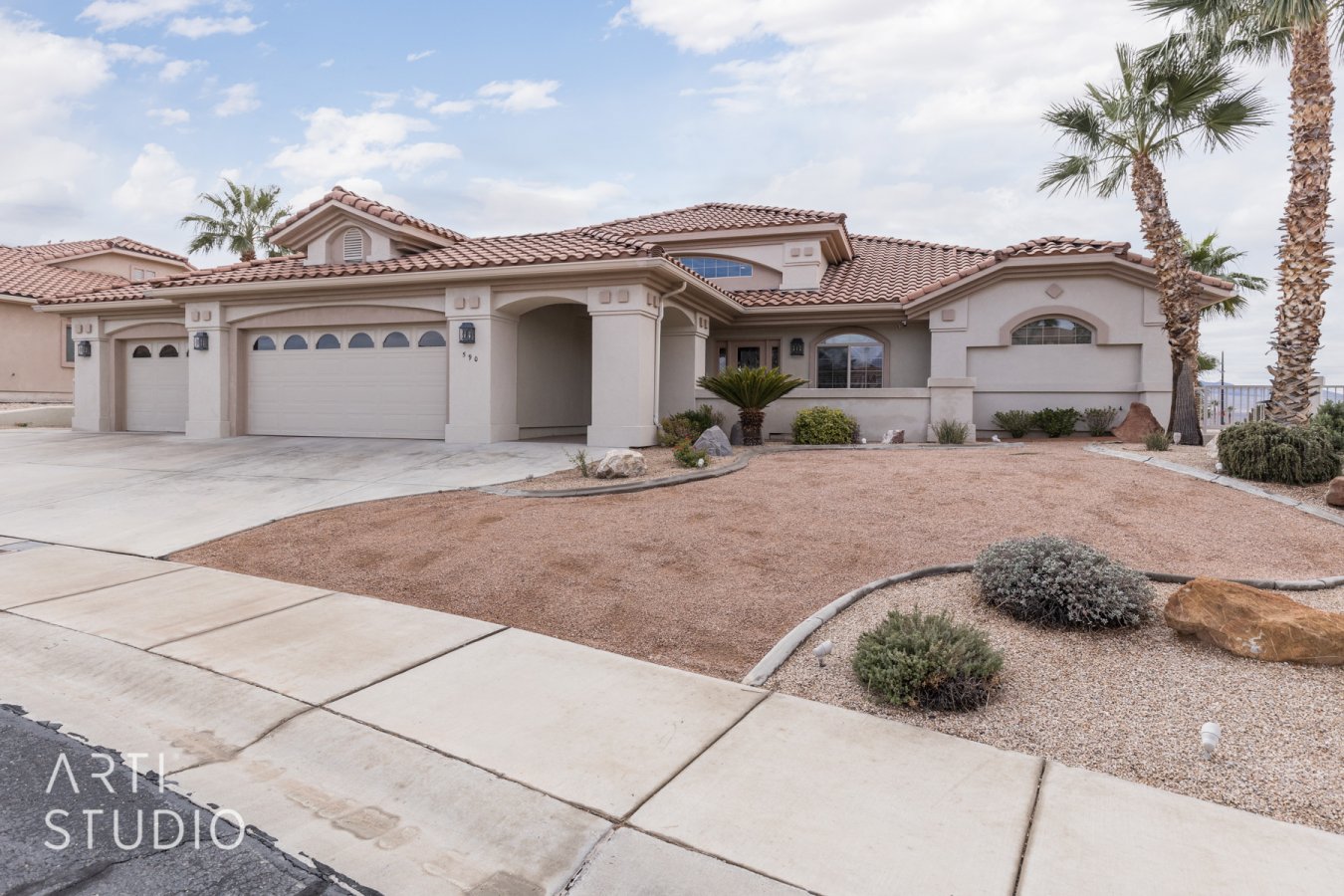 52440 This custom designed home is a fantastic in-law set up or use as a luxurious Corporate Home, it has it all. Room for a pool and on the renowned Canyons Golf Course with views galore! Four bedrooms and a den makes plenty of room for everyone. Two kitchens, three dishwashers, convection oven, three microwaves two laundry rooms, two walk-in showers, home theater gathering room, exercise room pre plumbed for indoor spa, courtyard, four patios, one deck the whole length of the home and lets not forget the ELEVATOR. Need just a getaway spot, this home has an extended garage to accommodate a boat or a very long truck and all your toys. One of the lowest HOA's in Mesquite, with the Clubhouse and discounted golf. Beautiful water resistant laminate flooring, tile and Berber carpet downstairs. Four, yes four garages! It doesn't stop there all in a gated community-don't miss this one of a kind home! Owner/Agent. Furniture Package Available. Come for a day stay for a lifetime...