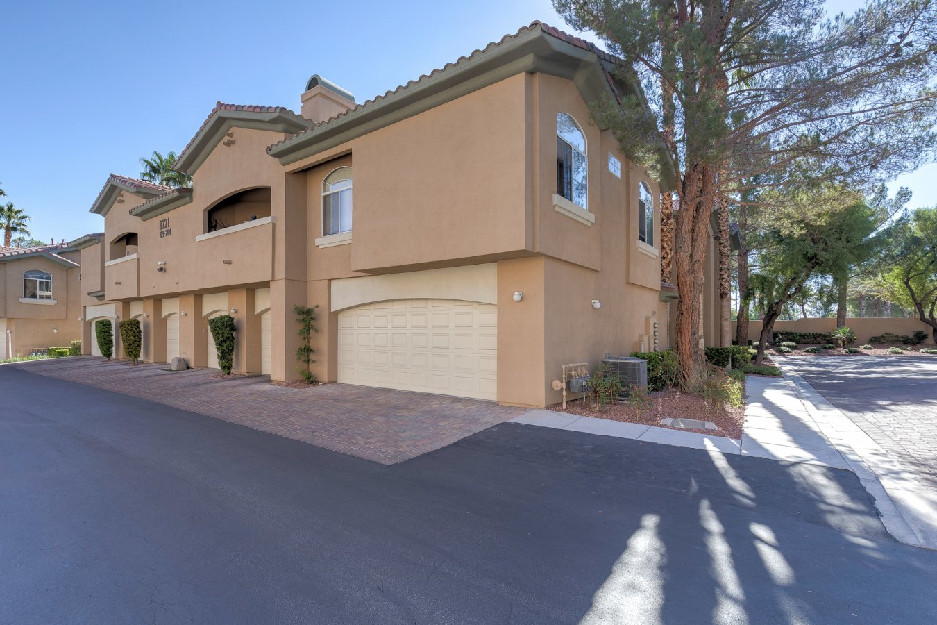 52764 Welcome to Red Hills, a condominium community in The Pueblos at Summerlin. This spacious condo, the largest floorpan in the community, features a large primary bedroom w/ walk-in closet, ensuite bathroom w/ walk-in shower and bathtub, open living room w/ fireplace, balcony, laundry room w/ sink, and attached oversized 2 car garage. Community features 24 hour guard gate, resort style pool and spa, clubhouse, fitness center, walking trails, and picnic areas.