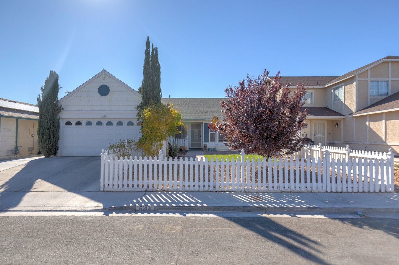 52789 Look at this adorable home, complete with white picket fence! No HOA! This 4 bedroom, 2 bath home is waiting for you! Step into a large living room with vaulted ceilings. Separate kitchen/dining room with plenty of windows. S/S appliances and butcher block island. Primary bedroom has 3 closets! New solar panels. New water heater. New A/C. New reverse osmosis. The back yard you'll find a large covered patio, easy maintenance turf, and a convenient shed! Hurry, don't miss out!