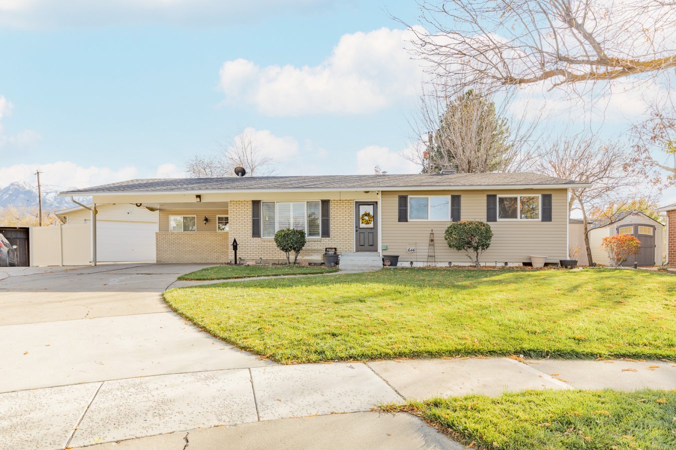 53062 This 5 bed, 3 bath Rambler has it all! Its nestled in a quiet cul-de-sac near schools, shopping, ski resorts and entertainment. This home has been meticulously taken care of since the day it was built and carries all the charm and comfort you will need. The well manicured yard features mountain views, honey crisp apple tree, huge covered patio, tool shop, garden sheds and oversized 2-car garage and carport. On the interior, this home features hardwood floors, formal living room, open kitchen, Den that could be used as a formal dinning, large kitchenette and family room downstairs. Come check it out!