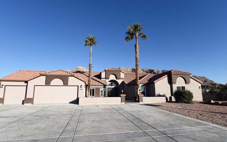 53151 Fabulous updated custom estate at the base of Sunrise Mountain once owned by Superstar Jaime Foxx. Gorgeous Mountain views and partial Strip views. Home sits on 1 acre lot with horses permitted. Adjacent nearby undeveloped lots might allow for the opportunity to develop facilities to board horses. Some Smart automation included. Updated gourmet kitchen with new cabinets, stainless steel appliances, huge island overlooking the cozy family room with beautiful fireplace. Formal Living Room, Formal dining room, Huge primary bedroom with sitting area, fireplace and access to be backyard. Large Primary Bath with beautiful stand alone tub, separate shower, Huge walk in closet, and a safe room. Large secondary bedrooms and bonus room can be used a office or 5th BR. New windows, updated bathrooms, new flooring throughout. Plantation shutters have been ordered for most windows and should be installed sometime around 12-10-21. Private electronic gated entrance. 3 car garage. Outdoor Kitchen.