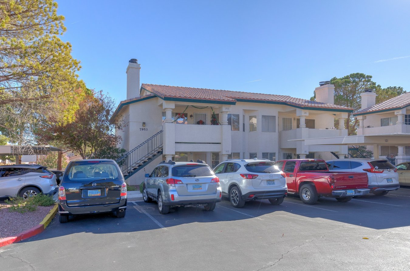 53266 PARDON OUR BOXES***WE'RE MOVING. Investor's delight. The tiled patio enters into this adorable ground-floor two-bedroom, two-bathroom condo on the outskirts of Summerlin. Located in a quiet cul-de-sac but with lots of parking options. Tiled flooring in traffic areas, but the warmth of carpeting in the bedrooms. Wood-burning fireplace in the living room for those chilly night. Wall-to-wall mirrored closet doors in the bedrooms. Just a short drive to Boca Park, but the immediate neighborhood has a Winco, Lowe's Home Improvement, and Trader Joe's. The 110 acre Kellogg Zaher Sports Complex has walking trails, three dog parks cells, soccer fields, picnic tables and BBQ's.