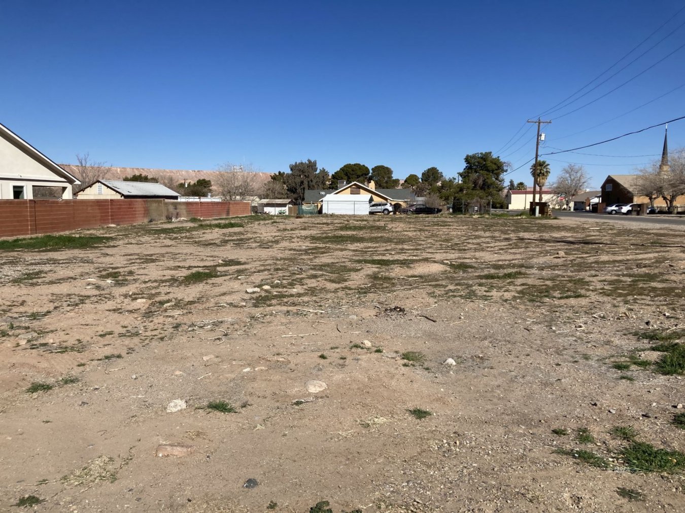 54957 Build your dream home. This flat corner lot is just waiting for new life. Rural living at its best. You could be looking at mountain views right from your kitchen window. Or out your living room. You decide which builder which plan and when you build it. Location is key on this lot. A local park with water splash pad and softball field and tennis courts and basketball court. A walking/bike trail that is lit up all the way back to town. Over 16,000 square feet you will have room for recreational toys or a shop. Set it up right and they might all fit!