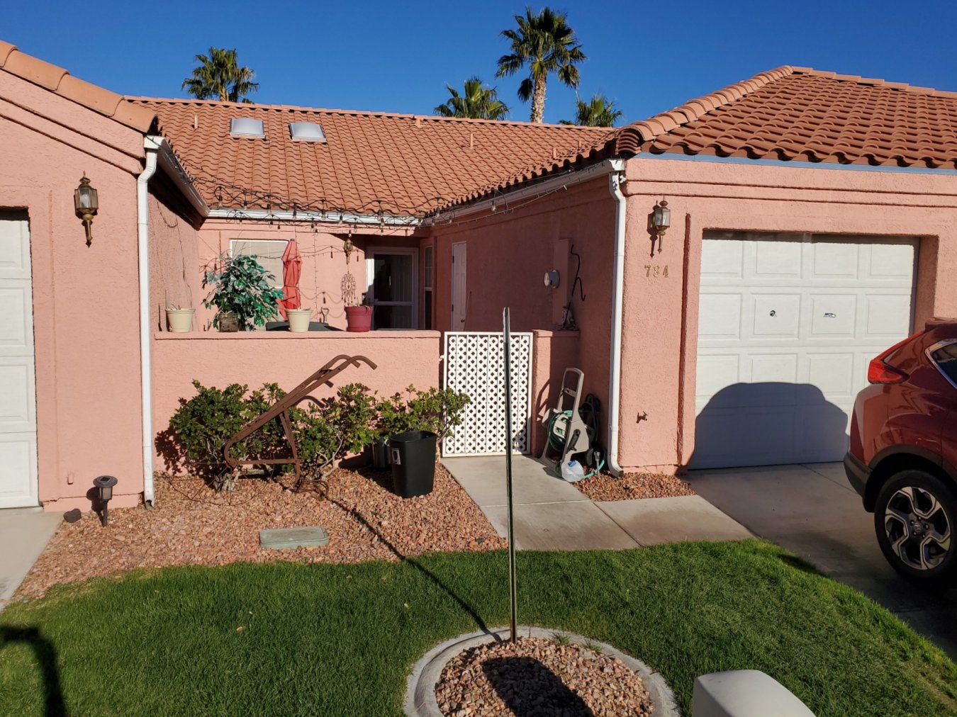 This upgraded townhouse on the North side of I-15 features upgraded flooring to vinyl planks and carpet. The kitchen has granite countertops and stainless steel appliances with a new microwave. A modern square iron chandelier hangs over the dining area. Both bathroom countertops are also granite have raised sections that allow for extra drawer space. The back yard is cozy and quiet with a great view of the community pool. There is a gate access from the back yard fence to the pool entrance just a few feet away along a flagstone path. The front courtyard has room for a sitting area with lights hanging across the eaves. When you see this quiet, cozy townhome, you won't want to leave.