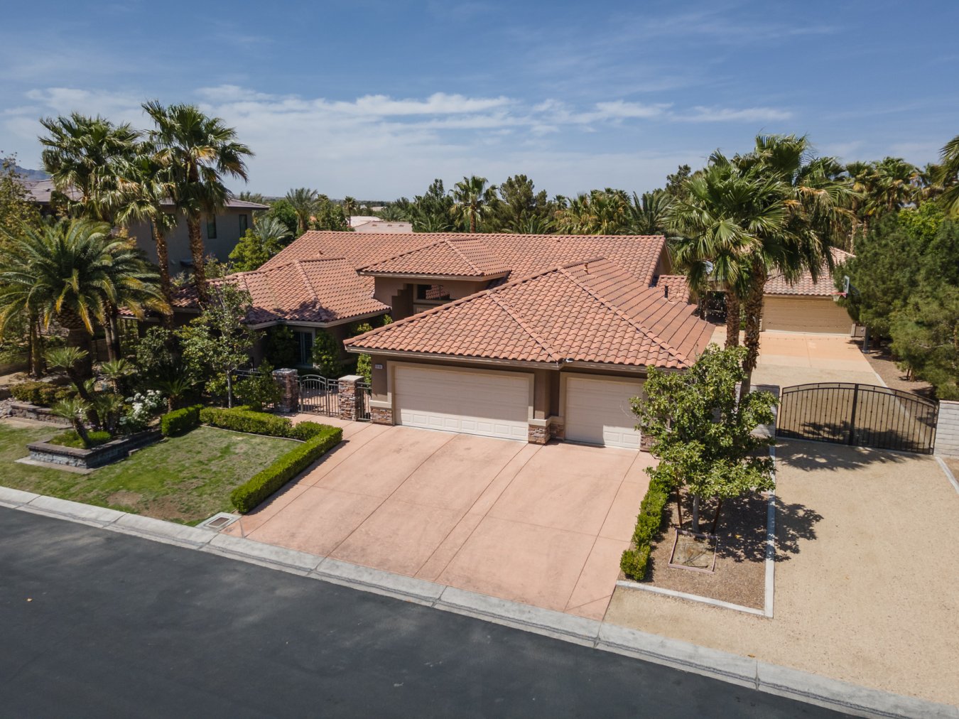 This is a fantastic single level home on a half acre lot in a quaint gated community in the NW part of the valley. All rooms are large & open. Dream come true gourmet kitchen with plenty of cabinet & counter space. Stainless steel GE Monogram appliance, huge walk in pantry! Spacious primary bedroom & bath, jetted tub, walk in closet, & two way fireplace. Attached oversized 3 car garage can fit the big toys plus a freestanding 2 car garage with storage. The full length covered patio offers a great space to bring the outdoors in & enjoy the refreshing pool/spa with beach entry & pebble tech finish. Huge built in BBQ also! Plenty of room for an RV or boat behind a gate for at least a 21X 60 pad. Not to mention the extra paved parking/basketball area! Truly a great home with many features. This property is located near freeway access, golf course, good schools, parks, restaurants, shopping & minutes from local casinos or Down Town Summerlin yet still in a ranch preserve!