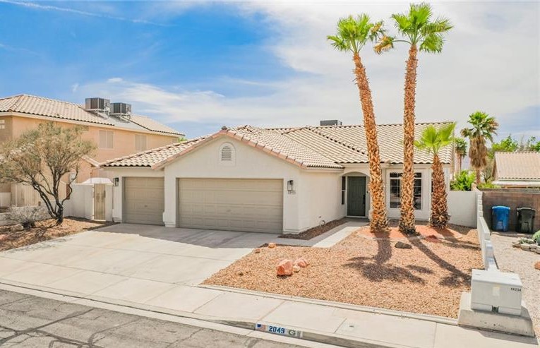 57593 Fully remodeled single story with 3 car garage and resort-style pool area! This home received a full designer makeover and features everything a homeowner could ask for: brand new air conditioner, designer selected interior/exterior paint, all new LVP flooring, custom kitchen with island, carefully selected modern fixtures and hardware, custom tile fireplace surround and backsplash.. the list goes on! The floor plan features an open living room/kitchen arrangement, vaulted ceilings, covered patio, 3 car garage and sparkling blue pool just in time for the heat! This home certainly won't last, schedule a tour today!