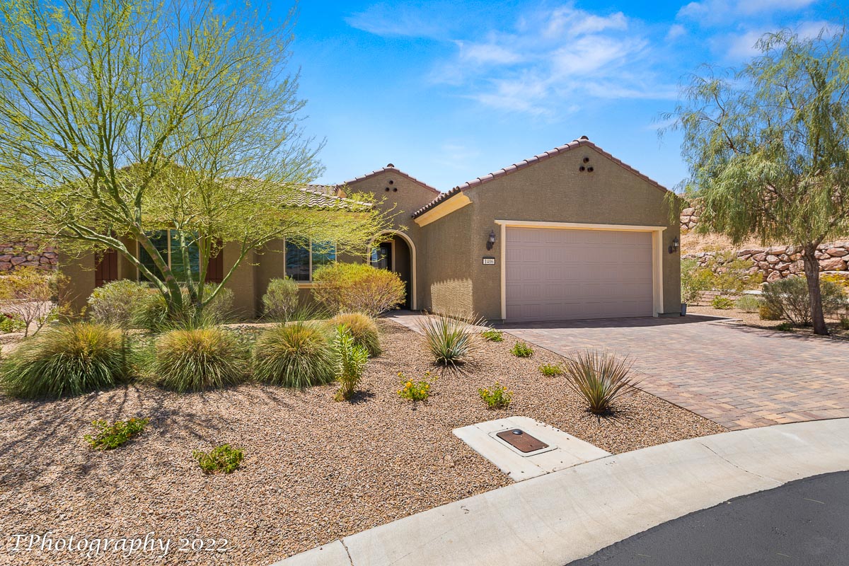57999 Looking for a Sun City home with more living space? This nicely appointed PURSUIT is situated on a hard-to-find large lot (.24acre) in a cul-de-sac with no neighbors to one side, and offers 10' ceilings, open concept great room, the addition of a sunroom, and a 6' bump out in the garage. The well-appointed kitchen has upgraded cabinets with under cabinet lighting, granite counter tops, a large island with single basin sink and custom pendant lighting overhead, and stainless appliances. The living room has an entertainment wall inset with electric fireplace. The owner's bedroom suite has its own door leading to the backyard patio, the bath has a custom-tiled walk-in shower, and the walk-in closet features an awesome closet organizer with jewelry drawer. Flooring is 20 x 20 tile throughout. Beautifully landscaped, enjoy the great backyard space with extended patio pavers, extra seating area, hot tub and room to add a pool. The insulated garage has storage shelving, epoxied floors, and a mini-split A/C system for heating & cooling. Current owners have added a decorative glass front door, repainted some of the interior walls, updated the dining room light and added more landscaping.