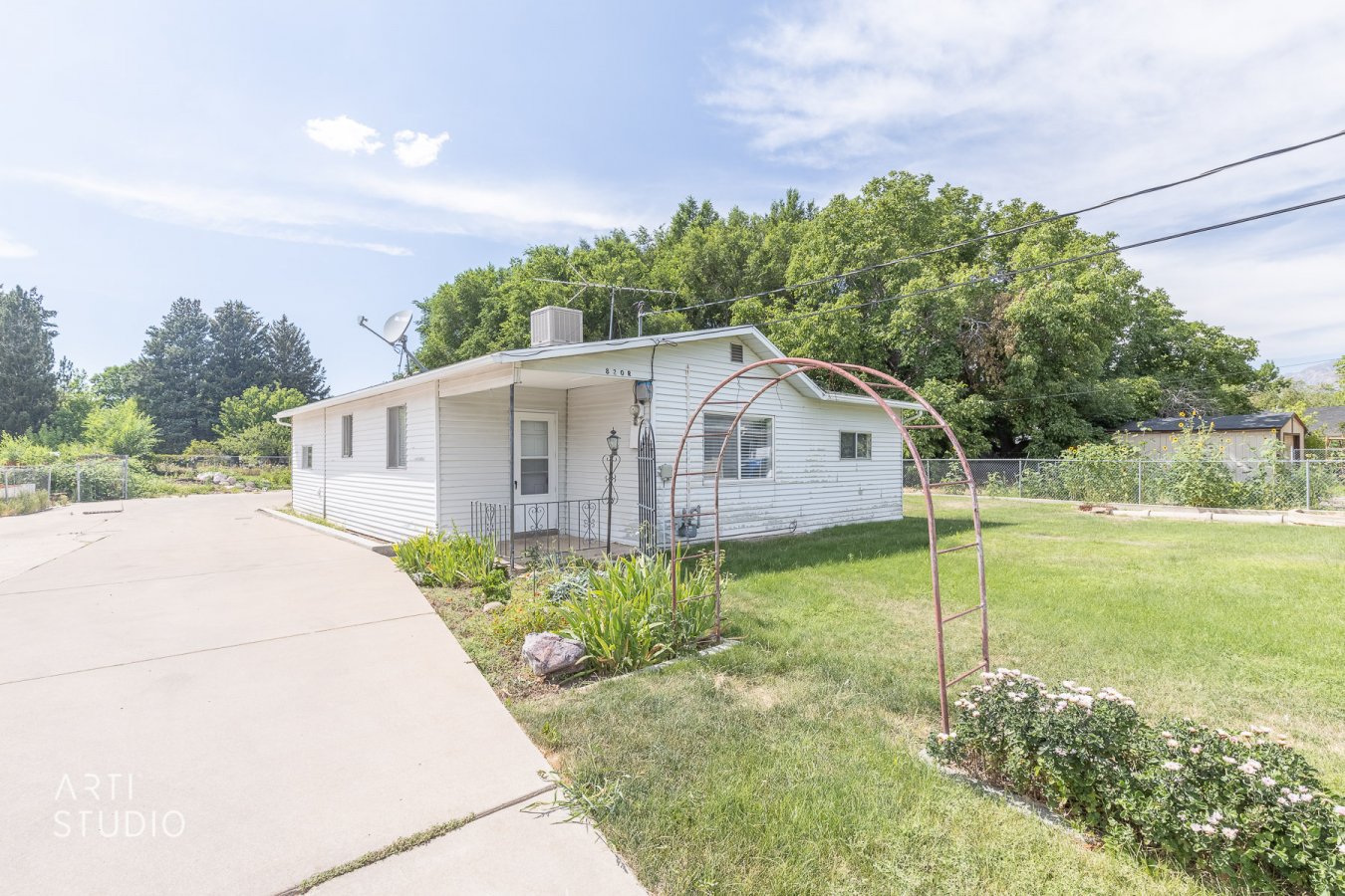 Single level home on large 0.34 acre lot. Mechanics dream garage that is heated with oil change pit in one garage bay. Potential studio apartment attached to the detached garage. Within walking distance to local schools, shopping, city park, and city swimming pool. Beautiful mountain views. Home is sold as-is. Seller will do no repairs. Call for a private showing!