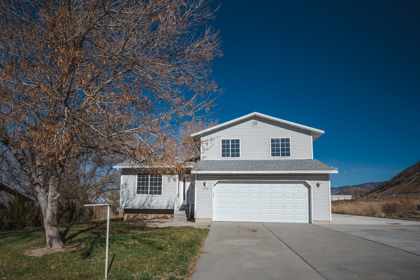 53077 Tooele home with tons of potential, make this house your home.
Plenty of room to sprawl out and decorate for the holidays with 2 spacious family rooms.
Home features tons of storage in basement, garage and great storage shed.
Newer roof, replaced within the last 10 years, HVAC and water heater replaced within the last 5 years.
RV pad and storage shed added 2 years ago.
Square footage figures are provided as a courtesy estimate only and were obtained from County Records . Buyer is advised to obtain an independent measurement.