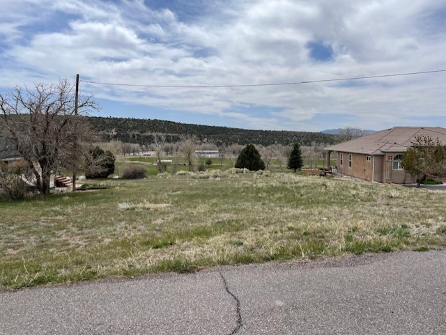 Fabulous .4 acre building lot to build your dream home on
overlooking the beautiful Canyon Breeze Golf Course! Beaver City water
meter in place, recently surveyed, power near property line, paved road
frontage, direct access to walking path on one side & golf course on
the other side, wildlife viewing and very quiet peaceful area!