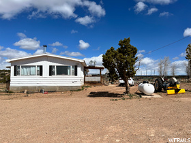 One of a kind horse property! 9.27 acres setting back off the roads. 1400 square foot manufactured home with 3 bedroom, 2 baths, woodstove. 4 shares Farnsworth Canal