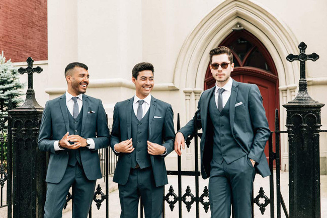 Dapper groomsmen in 3-piece suits | How to decide between wedding suit or tux