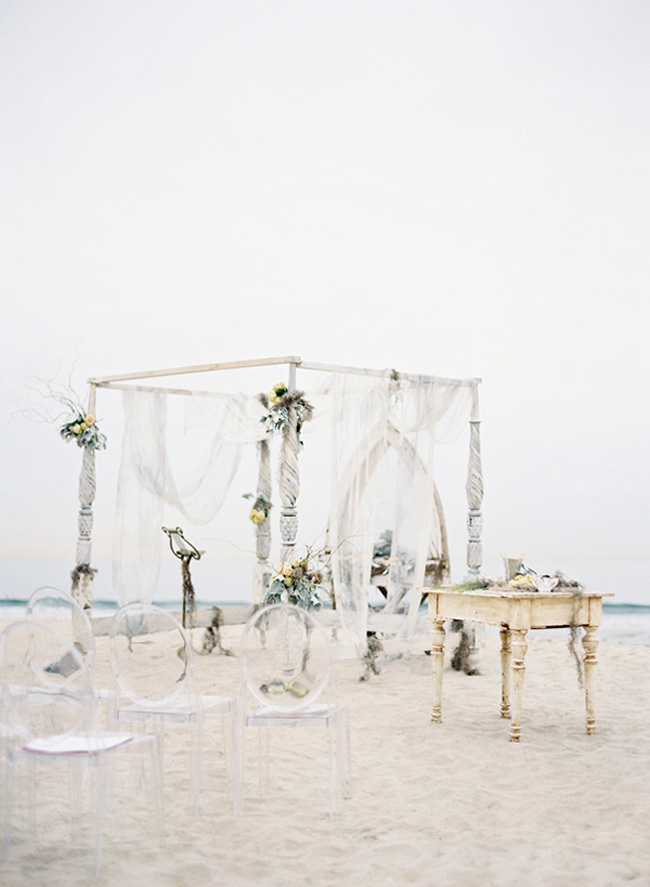 Wedding chuppah on the sand with sheer fabric Wedding chuppah on the sand with sheer fabric