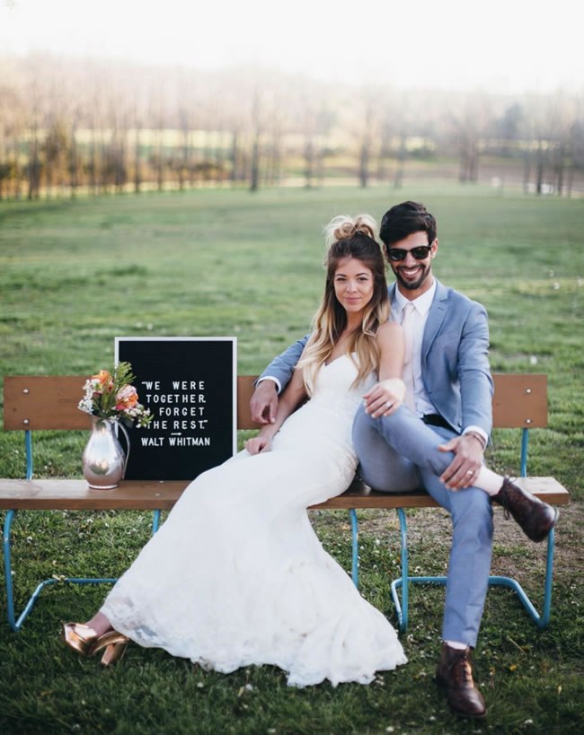 Modern newlyweds announce elopement on a letter board sign