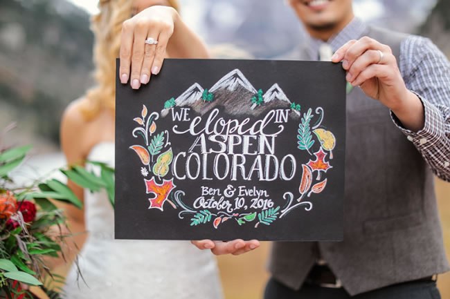 Colorful chalkboard sign announcing elopement in Aspen CO