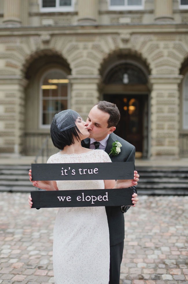 Funny Elopement Announcement Ideas Newlyweds with an 'It's True, We Eloped' sign