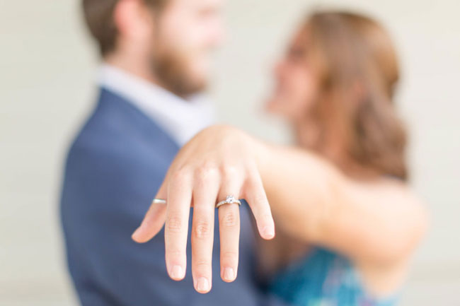 Announcing You Just Got Engaged on Social Media Bride holds out left hand so you can see her new engagement ring