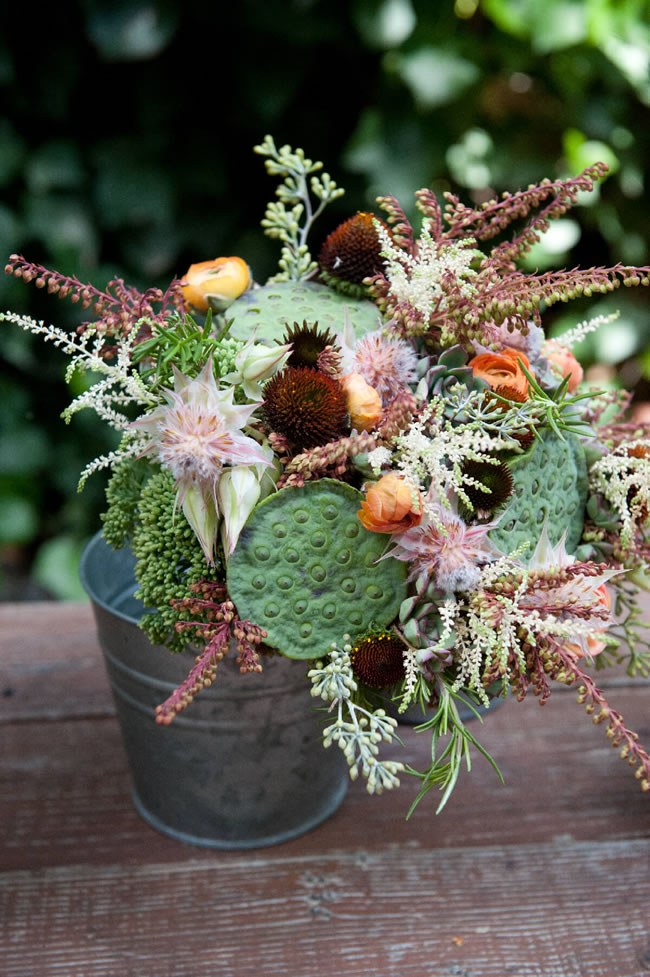 Interesting Wedding Centerpiece by Home Sweet Flowers Rustic wedding centerpiece with unusual and unique florals
