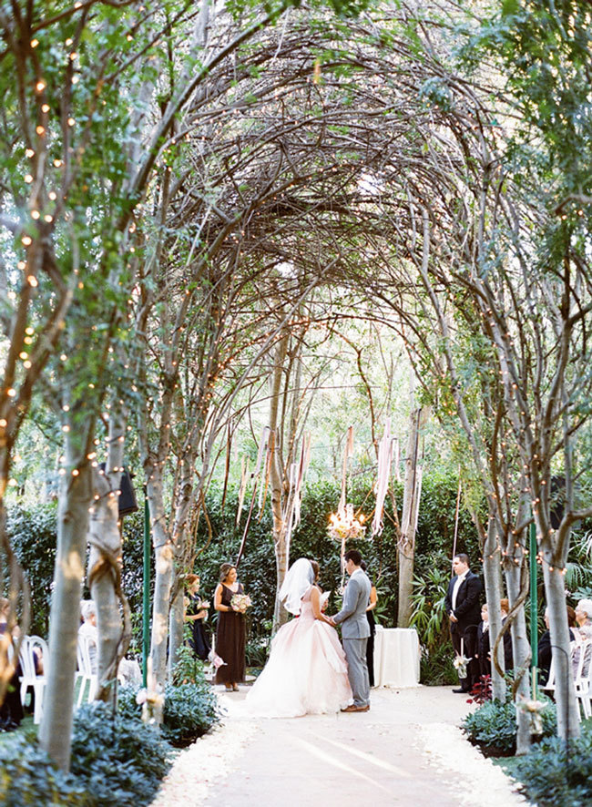 Wedding ceremony down a tree-lined aisle at Hartley Botanica in Somis, CA Wedding ceremony down a tree-lined aisle at Hartley Botanica in Somis, CA