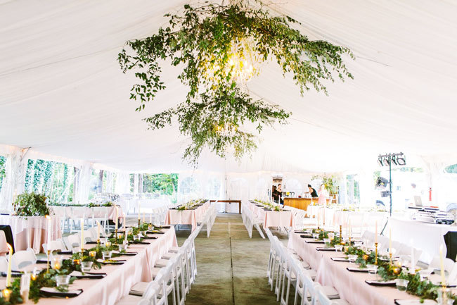 Hanging greenery installation at a tented wedding at Historic Shady Lane in Manchester, PA Hanging greenery installation at a tented wedding at Historic Shady Lane in Manchester, PA