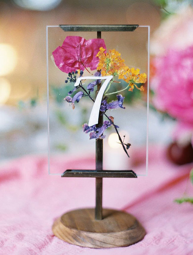 Clear acrylic wedding table number with pressed flowers Clear acrylic wedding table number with pressed flowers