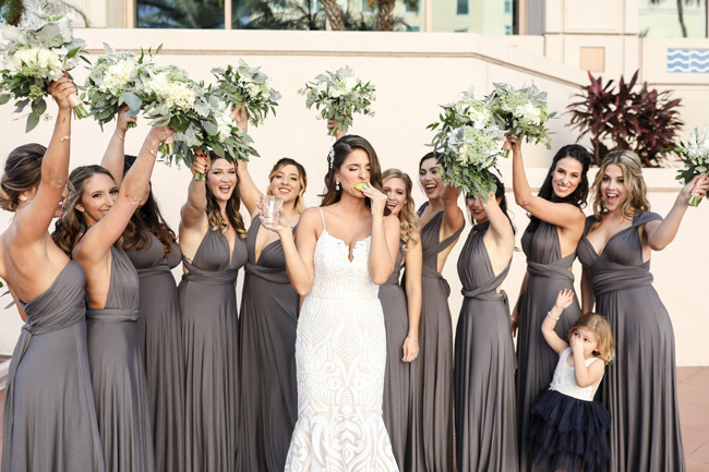How To Treat Your Bridesmaids | Bride taking a shot with lime as bridesmaids cheer her on How To Treat Your Bridesmaids | Bride taking a shot with lime as bridesmaids cheer her on