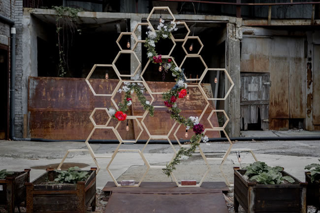 Geometric ceremony structure at an industrial wedding