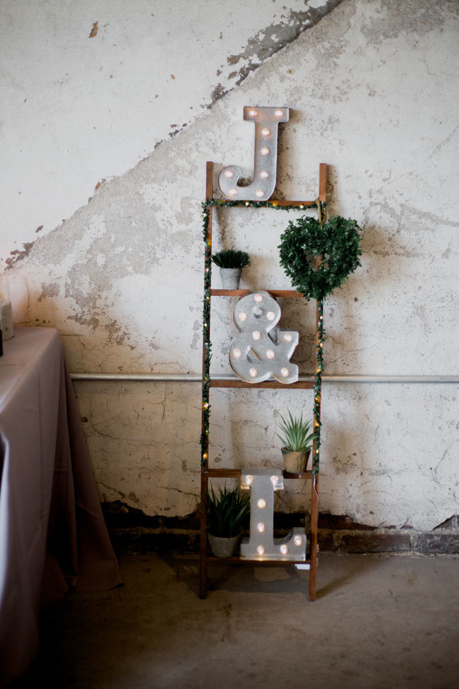 Monogram marquee lights at an industrial-chic wedding Monogram marquee lights at an industrial-chic wedding